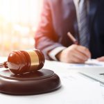 Wooden Gavel On Table Attorney Working In Courtroom