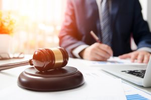 Wooden Gavel On Table Attorney Working In Courtroom Press