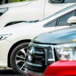 Selective Focus On Side View Of White Car Parked At Outdoor Car Parking Lot  Used Car For Sale And Rental Service Business  Automobile Parking Space  Car Dealership Concept  Auto Leasing And Insurance