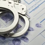 Handcuffs On Fingerprints Document